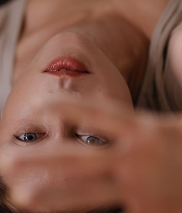 Woman with a calm expression, eyes closed gently, symbolizing relaxation and focus.